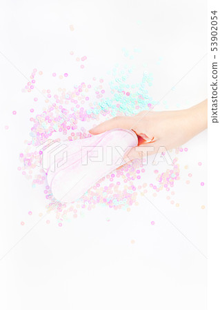Woman hand holding daily sanitary napkins Woman hand holding daily sanitary napkins 53902054