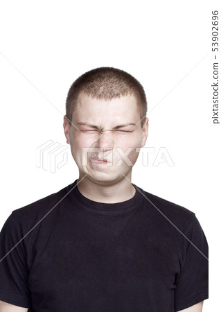 Portrait of young man. Facial expression. Portrait of young man. Facial expression. 53902696