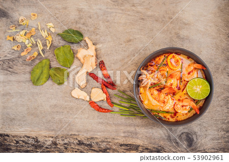 Prawn and lemon grass soup with mushrooms,Tom Yam Kung ,thai food in wooden background, top view 53902961