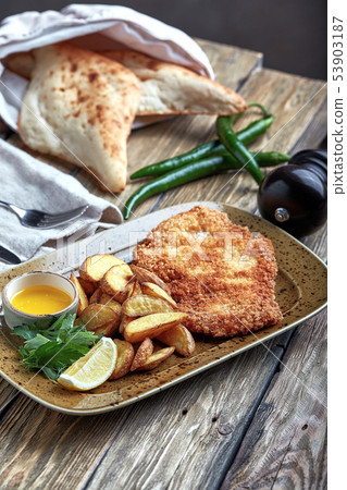 Tasty schnitzel with boiled potato. Top view, flat lay food Tasty schnitzel with boiled potato. Top view, flat lay food 53903187