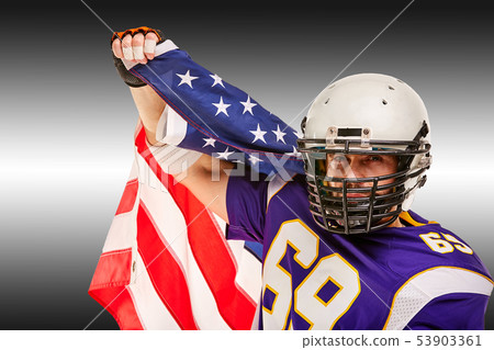 American football player closeup portrait. American football player with an american flag in his American football player closeup portrait. American football player with an american flag in his 53903361