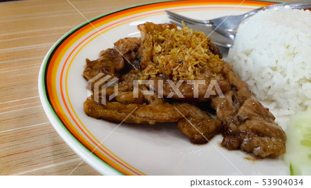 Fried Pork with Garlic Pepper on Rice. 53904034