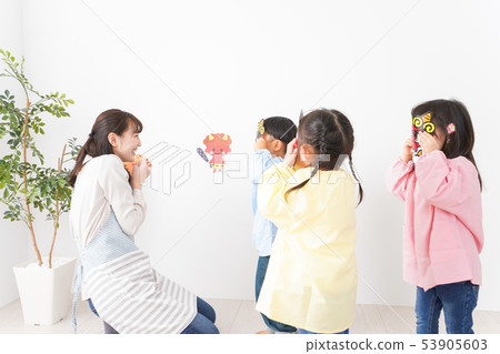 Children doing seasoning beans in kindergarten 53905603