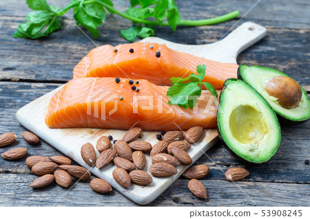 Raw Salmon with Almond and Avocado on a wooden Raw Salmon with Almond and Avocado on a wooden 53908245