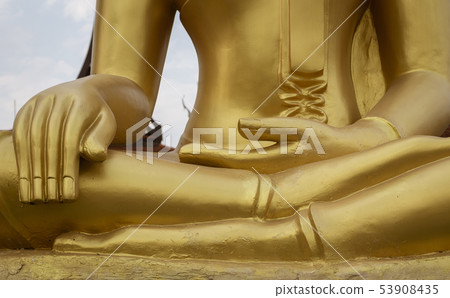 Closeup of hands of Golden Buddha Statue 53908435