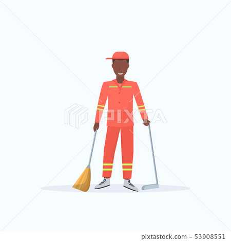 male street cleaner holding broom and dustpan african american man sweeping garbage in scoop male street cleaner holding broom and dustpan african american man sweeping garbage in scoop 53908551