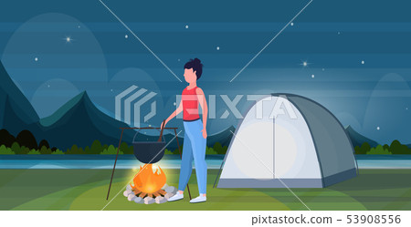 woman hiker cooking meals girl preparing food in bowler boiling pot at campfire hiking concept woman hiker cooking meals girl preparing food in bowler boiling pot at campfire hiking concept 53908556