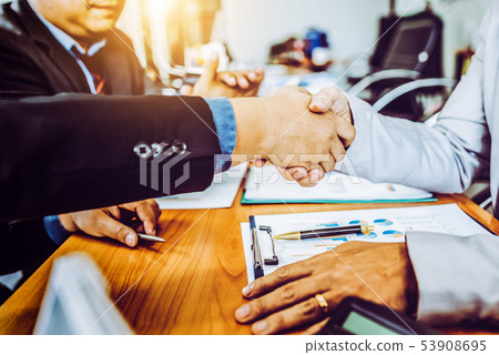 Business partner colleagues shake hands on meeting 53908695