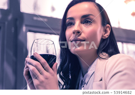 Positive beautiful nice woman enjoying red wine 53914682