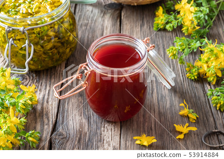 Red oil made from St. John's wort flowers Red oil made from St. John's wort flowers 53914884