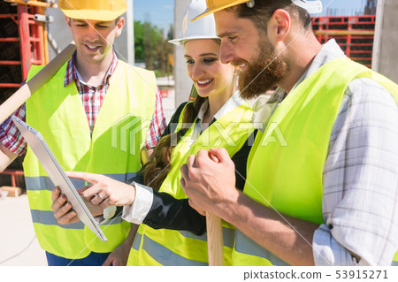 Architect or manager showing the electronic plan of the building Architect or manager showing the electronic plan of the building 53915271