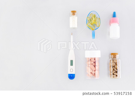various medical products, natural supplement and thermometer flat lay with copy space 53917158