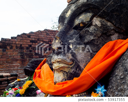 Buddha head in Wat Worachet, Ayutthaya, Thailand. Buddha head in Wat Worachet, Ayutthaya, Thailand. 53917355