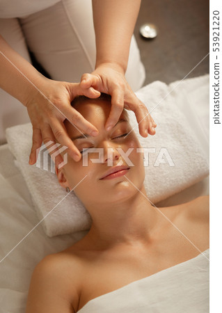 Relaxed good-looking lady with soft smile peacefully lying Relaxed good-looking lady with soft smile peacefully lying 53921220