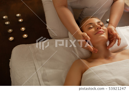 Good-looking young woman with tied hair being extremely satisfied Good-looking young woman with tied hair being extremely satisfied 53921247