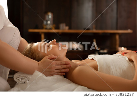 Young beautiful woman with closed eyes being in calm atmosphere Young beautiful woman with closed eyes being in calm atmosphere 53921257