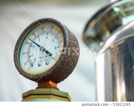 Water pressure gauge  with rust and pipes of a hom 53921265