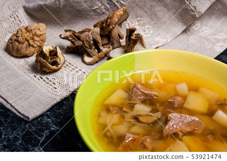 Composition with mushroom soup in green plate, Composition with mushroom soup in green plate, 53921474