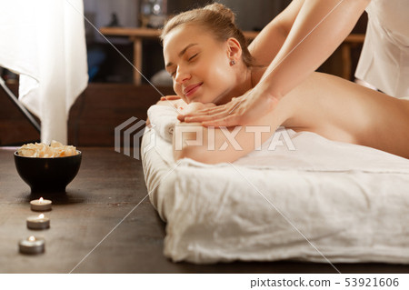 Pleasant good-looking partly-naked woman enjoying touches of focused Pleasant good-looking partly-naked woman enjoying touches of focused 53921606