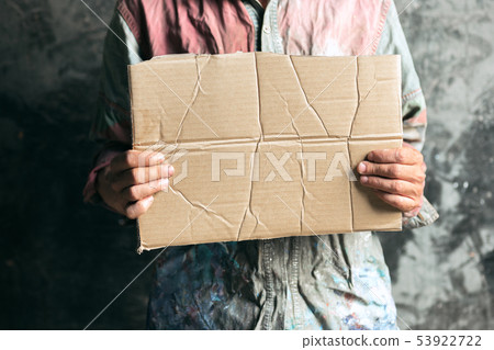 Male beggar hands seeking food or money at public path way 53922722