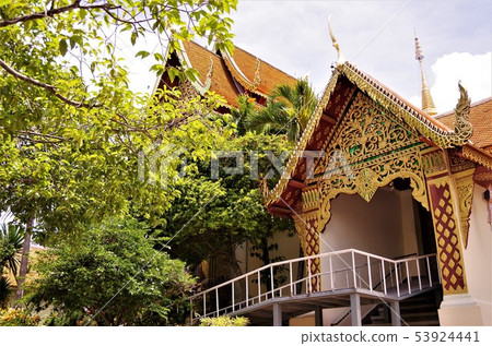 Thai Buddhist temple, image wrapped in green (Chiang Mai) Thai Buddhist temple, image wrapped in green (Chiang Mai) 53924441