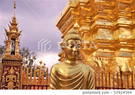 Pagodas and Buddha image of Thai Buddhist temple with golden color (Chiang Mai) Pagodas and Buddha image of Thai Buddhist temple with golden color (Chiang Mai) 53924564