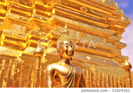 Pagodas and Buddha image of Thai Buddhist temple with golden color (Chiang Mai) Pagodas and Buddha image of Thai Buddhist temple with golden color (Chiang Mai) 53924581