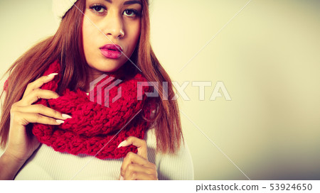 Mulatto woman wearing warm winter clothing, 53924650