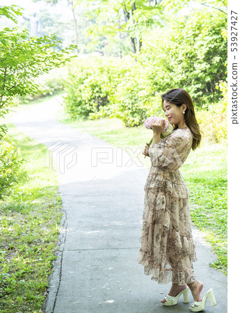 Namsan Park in Seoul Young female model enjoying flowers in the forest 53927427