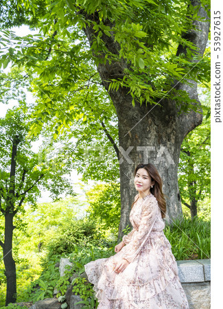 Young female model taking a break in the forest of Namsan Park in Seoul 53927615