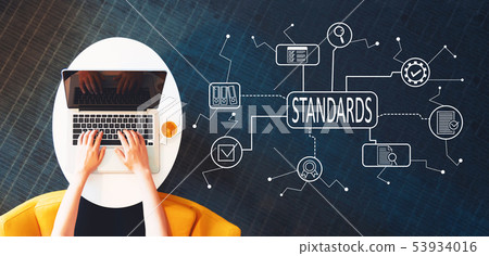 Standard quality control approval with person using a laptop 53934016