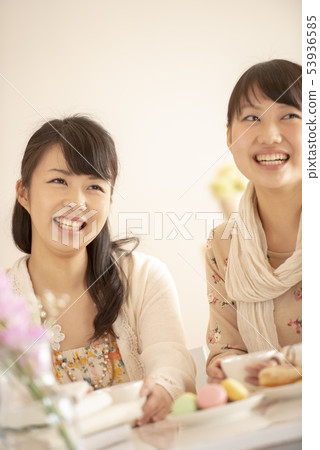 Two women enjoying tea time 53936585