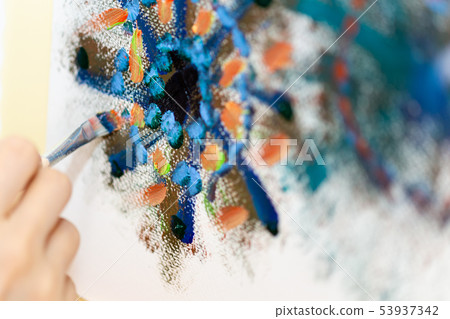 Artist painting on an easel Artist painting on an easel 53937342