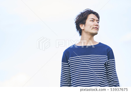 Young man blue sky 53937675