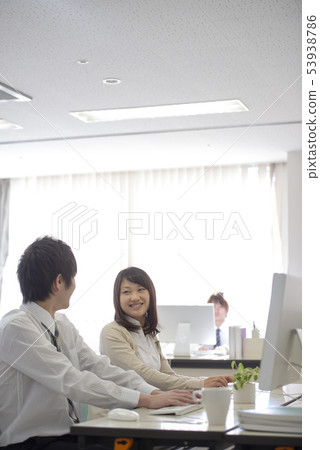 Business woman talking in the office Business woman talking in the office 53938786