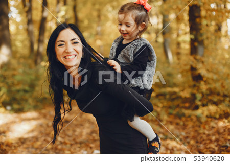 Cute and stylish family in a autumn park 53940620