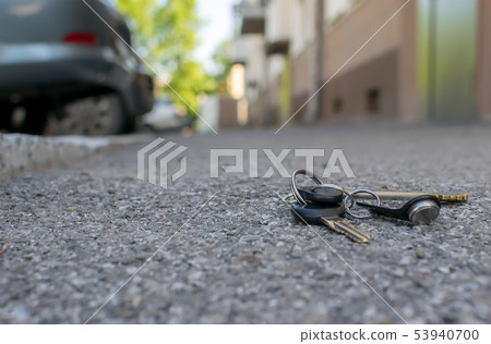 lost bunch of keys lies on the asphalted sidewalk lost bunch of keys lies on the asphalted sidewalk 53940700