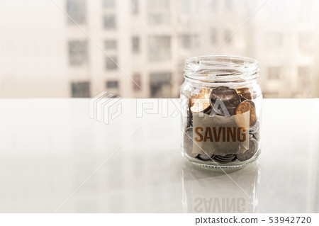 save money, coins in glass jar financial concept 53942720