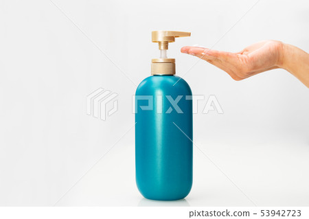 women hand apply hair shampoo conditioner bottle 53942723