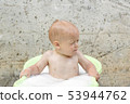 Funny cute bay boy taking a bath outdoor. Funny toddler in a soapy foam. 53944762