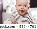 Portrait of Cute adorable baby boy smiling and looking at camera. 53944791