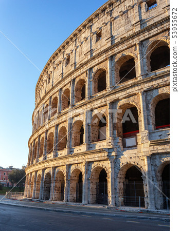 Italian monument to the Colosseum in the center of Rome in the afternoon. Italian monument to the Colosseum in the center of Rome in the afternoon. 53955672