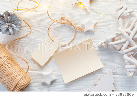 mockup Christmas kraft gift boxes with tag on wooden background. Top view for greeting card 53955809