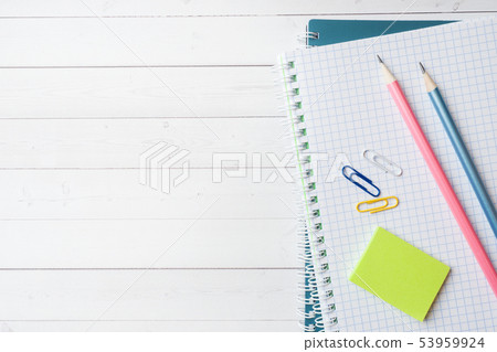Clean white notebook and pencil with copy space Clean white notebook and pencil with copy space 53959924