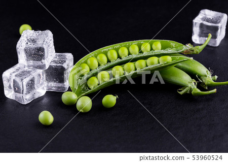 Sugar snap peas with mint on a rustic wood Sugar snap peas with mint on a rustic wood 53960524