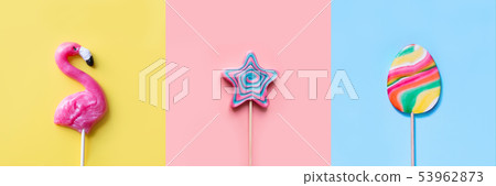 Three colorful lollipops candy on pastel. Funny concept. Top view. Collage. Three colorful lollipops candy on pastel. Funny concept. Top view. Collage. 53962873