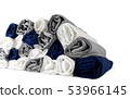Stack of rolled t-shirts on white background 53966145