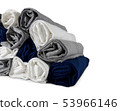 Colours rolled t-shirts di cut on white wallpaper. 53966146
