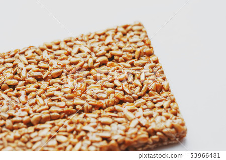 Healthy snacks. Fitness diet food. Kozinaki fritter, seeds, energy bars. White background top view 53966481