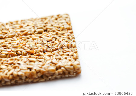 Healthy snacks. Fitness diet food. Kozinaki fritter, seeds, energy bars. White background top view 53966483
